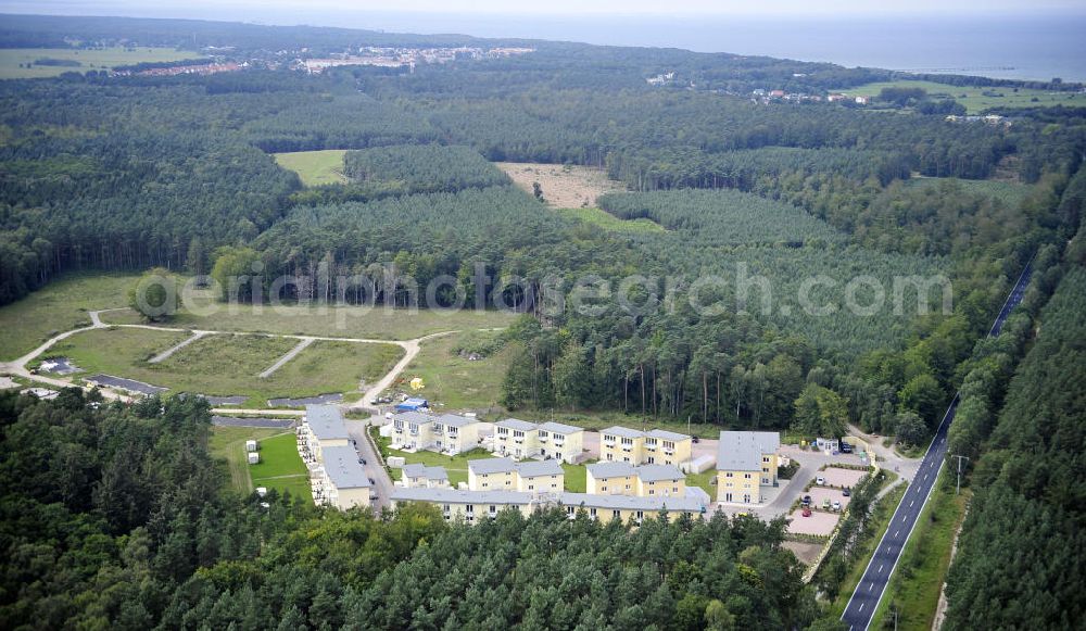 Graal-Müritz from the bird's eye view: Blick auf den Ferienwohnpark im Küstenwald der HAWO Bauträger KG in unmittelbarer Strandnähe im Ostseeheilbad Graal-Müritz. Aus einer ehemaligen NVA Liegenschaft entstanden attraktive Ferienhäuser und Ferienwohneinheiten zum Verkauf und zur Vermietung. View of the coastal forest of the housing estate developers HAWO KG near the beach in the spa town of Graal Müritz.