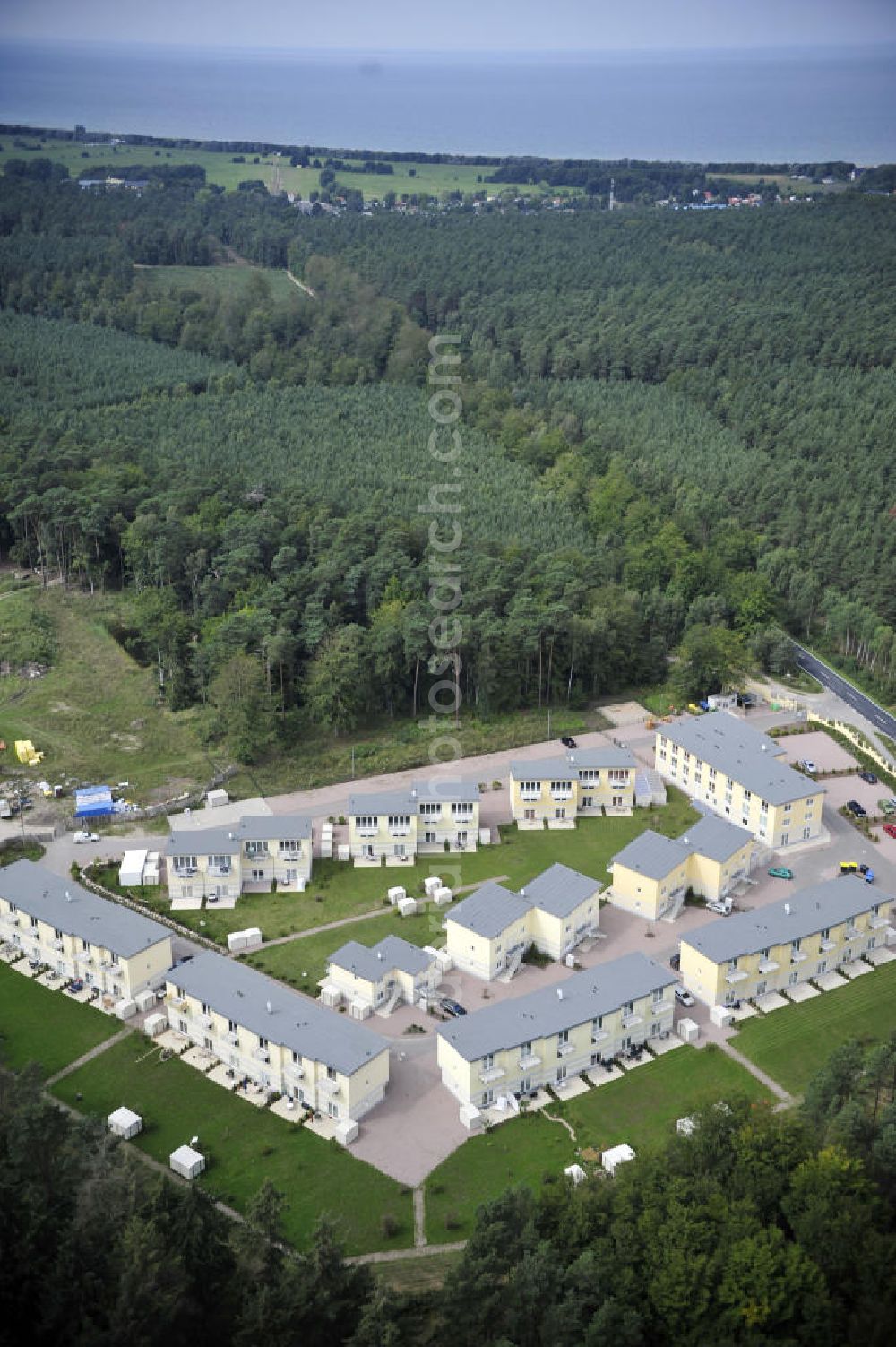 Graal-Müritz from above - Blick auf den Ferienwohnpark im Küstenwald der HAWO Bauträger KG in unmittelbarer Strandnähe im Ostseeheilbad Graal-Müritz. Aus einer ehemaligen NVA Liegenschaft entstanden attraktive Ferienhäuser und Ferienwohneinheiten zum Verkauf und zur Vermietung. View of the coastal forest of the housing estate developers HAWO KG near the beach in the spa town of Graal Müritz.