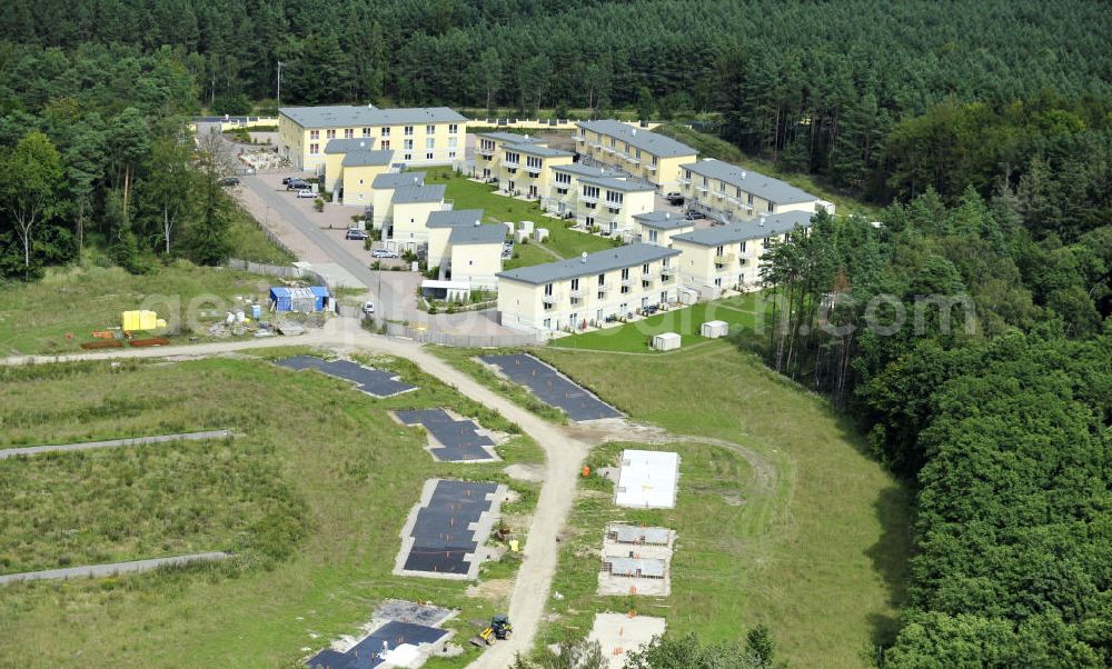 Graal-Müritz from the bird's eye view: Blick auf den Ferienwohnpark im Küstenwald der HAWO Bauträger KG in unmittelbarer Strandnähe im Ostseeheilbad Graal-Müritz. Aus einer ehemaligen NVA Liegenschaft entstanden attraktive Ferienhäuser und Ferienwohneinheiten zum Verkauf und zur Vermietung. View of the coastal forest of the housing estate developers HAWO KG near the beach in the spa town of Graal Müritz.