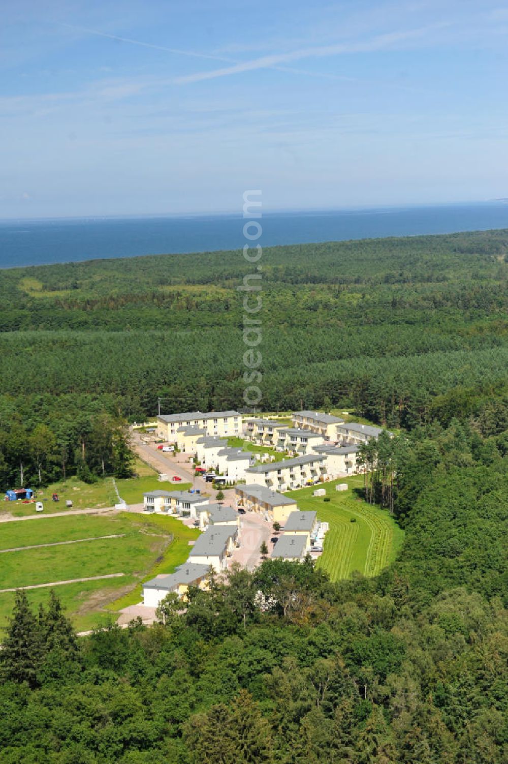 OSTSEEBAD GRAL-MÜRITZ from the bird's eye view: Blick auf den Ferienwohnpark im Küstenwald der HAWO Bauträger KG in unmittelbarer Strandnähe im Ostseeheilbad Graal-Müritz. Aus einer ehemaligen NVA Liegenschaft entstanden bisher in zwei Bauabschnitten attraktive Ferienhäuser und Ferienwohneinheiten zum Verkauf und zur Vermietung. View of the coastal forest of the housing estate developers HAWO KG near the beach in the spa town of Graal Müritz.