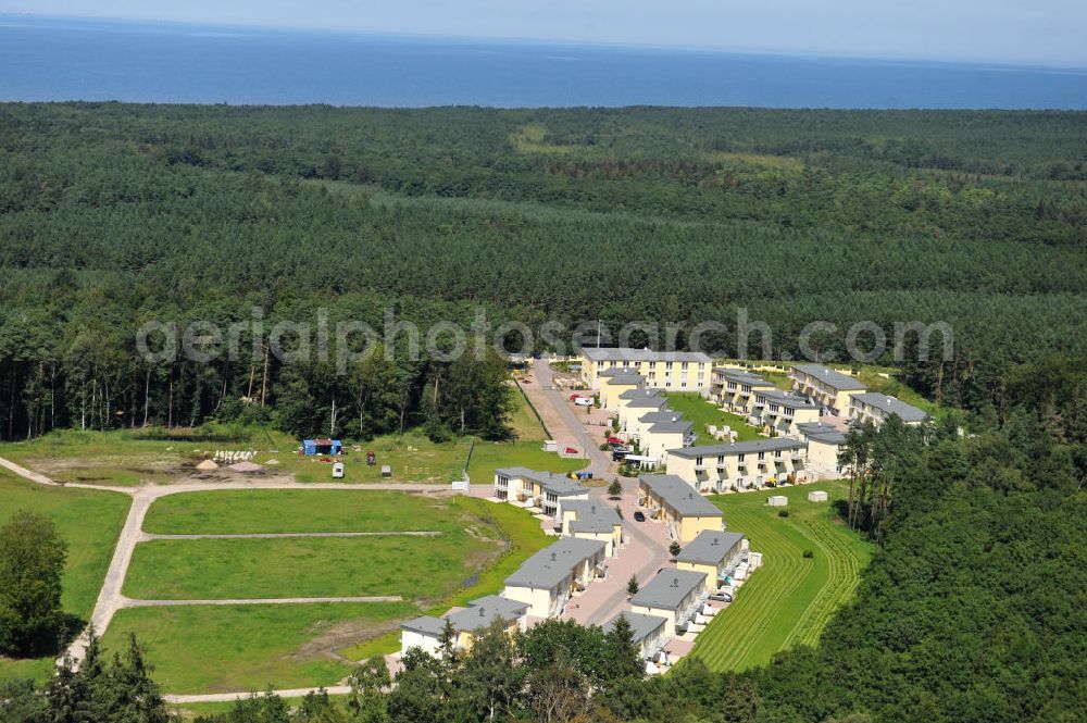 Aerial image OSTSEEBAD GRAL-MÜRITZ - Blick auf den Ferienwohnpark im Küstenwald der HAWO Bauträger KG in unmittelbarer Strandnähe im Ostseeheilbad Graal-Müritz. Aus einer ehemaligen NVA Liegenschaft entstanden bisher in zwei Bauabschnitten attraktive Ferienhäuser und Ferienwohneinheiten zum Verkauf und zur Vermietung. View of the coastal forest of the housing estate developers HAWO KG near the beach in the spa town of Graal Müritz.