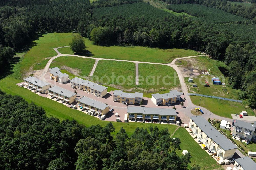 OSTSEEBAD GRAL-MÜRITZ from the bird's eye view: Blick auf den Ferienwohnpark im Küstenwald der HAWO Bauträger KG in unmittelbarer Strandnähe im Ostseeheilbad Graal-Müritz. Aus einer ehemaligen NVA Liegenschaft entstanden bisher in zwei Bauabschnitten attraktive Ferienhäuser und Ferienwohneinheiten zum Verkauf und zur Vermietung. View of the coastal forest of the housing estate developers HAWO KG near the beach in the spa town of Graal Müritz.