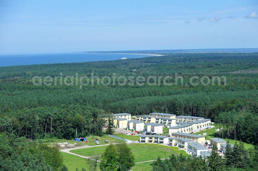 OSTSEEBAD GRAL-MÜRITZ from the bird's eye view: Blick auf den Ferienwohnpark im Küstenwald der HAWO Bauträger KG in unmittelbarer Strandnähe im Ostseeheilbad Graal-Müritz. Aus einer ehemaligen NVA Liegenschaft entstanden bisher in zwei Bauabschnitten attraktive Ferienhäuser und Ferienwohneinheiten zum Verkauf und zur Vermietung. View of the coastal forest of the housing estate developers HAWO KG near the beach in the spa town of Graal Müritz.