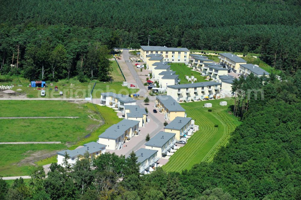 OSTSEEBAD GRAL-MÜRITZ from the bird's eye view: Blick auf den Ferienwohnpark im Küstenwald der HAWO Bauträger KG in unmittelbarer Strandnähe im Ostseeheilbad Graal-Müritz. Aus einer ehemaligen NVA Liegenschaft entstanden bisher in zwei Bauabschnitten attraktive Ferienhäuser und Ferienwohneinheiten zum Verkauf und zur Vermietung. View of the coastal forest of the housing estate developers HAWO KG near the beach in the spa town of Graal Müritz.