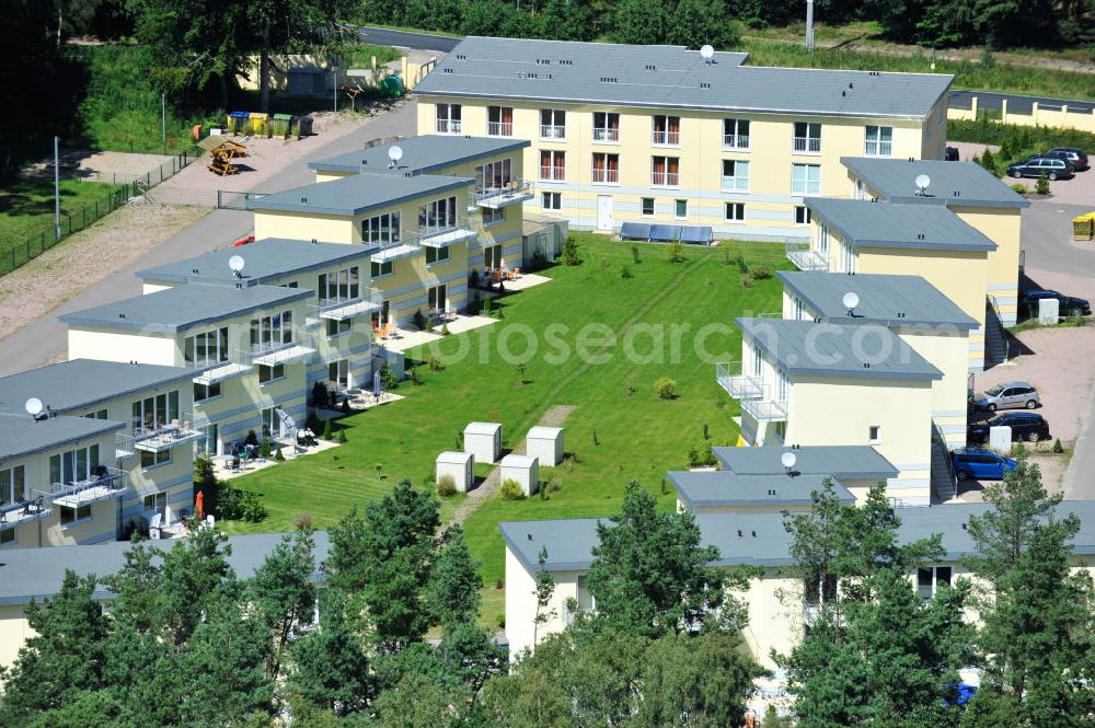 Aerial photograph OSTSEEBAD GRAL-MÜRITZ - Blick auf den Ferienwohnpark im Küstenwald der HAWO Bauträger KG in unmittelbarer Strandnähe im Ostseeheilbad Graal-Müritz. Aus einer ehemaligen NVA Liegenschaft entstanden bisher in zwei Bauabschnitten attraktive Ferienhäuser und Ferienwohneinheiten zum Verkauf und zur Vermietung. View of the coastal forest of the housing estate developers HAWO KG near the beach in the spa town of Graal Müritz.