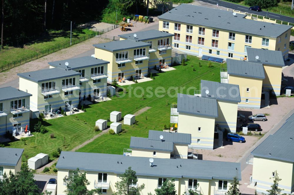 OSTSEEBAD GRAL-MÜRITZ from the bird's eye view: Blick auf den Ferienwohnpark im Küstenwald der HAWO Bauträger KG in unmittelbarer Strandnähe im Ostseeheilbad Graal-Müritz. Aus einer ehemaligen NVA Liegenschaft entstanden bisher in zwei Bauabschnitten attraktive Ferienhäuser und Ferienwohneinheiten zum Verkauf und zur Vermietung. View of the coastal forest of the housing estate developers HAWO KG near the beach in the spa town of Graal Müritz.