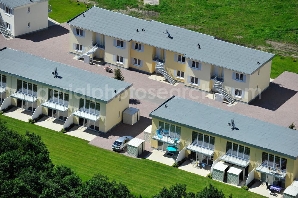 Aerial image OSTSEEBAD GRAL-MÜRITZ - Blick auf den Ferienwohnpark im Küstenwald der HAWO Bauträger KG in unmittelbarer Strandnähe im Ostseeheilbad Graal-Müritz. Aus einer ehemaligen NVA Liegenschaft entstanden bisher in zwei Bauabschnitten attraktive Ferienhäuser und Ferienwohneinheiten zum Verkauf und zur Vermietung. View of the coastal forest of the housing estate developers HAWO KG near the beach in the spa town of Graal Müritz.