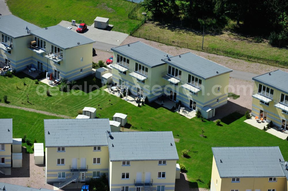 OSTSEEBAD GRAL-MÜRITZ from the bird's eye view: Blick auf den Ferienwohnpark im Küstenwald der HAWO Bauträger KG in unmittelbarer Strandnähe im Ostseeheilbad Graal-Müritz. Aus einer ehemaligen NVA Liegenschaft entstanden bisher in zwei Bauabschnitten attraktive Ferienhäuser und Ferienwohneinheiten zum Verkauf und zur Vermietung. View of the coastal forest of the housing estate developers HAWO KG near the beach in the spa town of Graal Müritz.