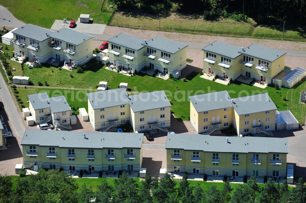 OSTSEEBAD GRAL-MÜRITZ from the bird's eye view: Blick auf den Ferienwohnpark im Küstenwald der HAWO Bauträger KG in unmittelbarer Strandnähe im Ostseeheilbad Graal-Müritz. Aus einer ehemaligen NVA Liegenschaft entstanden bisher in zwei Bauabschnitten attraktive Ferienhäuser und Ferienwohneinheiten zum Verkauf und zur Vermietung. View of the coastal forest of the housing estate developers HAWO KG near the beach in the spa town of Graal Müritz.