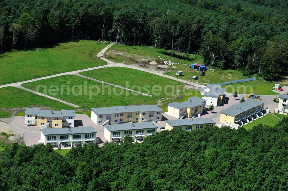 Aerial image OSTSEEBAD GRAL-MÜRITZ - Blick auf den Ferienwohnpark im Küstenwald der HAWO Bauträger KG in unmittelbarer Strandnähe im Ostseeheilbad Graal-Müritz. Aus einer ehemaligen NVA Liegenschaft entstanden bisher in zwei Bauabschnitten attraktive Ferienhäuser und Ferienwohneinheiten zum Verkauf und zur Vermietung. View of the coastal forest of the housing estate developers HAWO KG near the beach in the spa town of Graal Müritz.