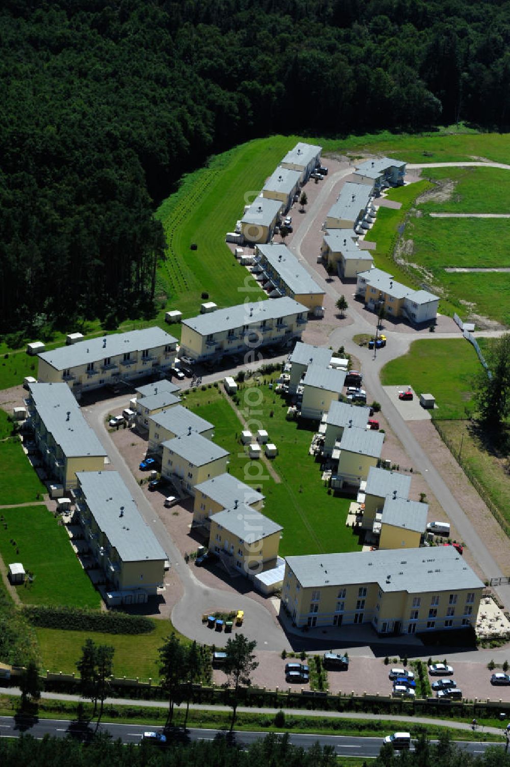 Aerial photograph OSTSEEBAD GRAL-MÜRITZ - Blick auf den Ferienwohnpark im Küstenwald der HAWO Bauträger KG in unmittelbarer Strandnähe im Ostseeheilbad Graal-Müritz. Aus einer ehemaligen NVA Liegenschaft entstanden bisher in zwei Bauabschnitten attraktive Ferienhäuser und Ferienwohneinheiten zum Verkauf und zur Vermietung. View of the coastal forest of the housing estate developers HAWO KG near the beach in the spa town of Graal Müritz.