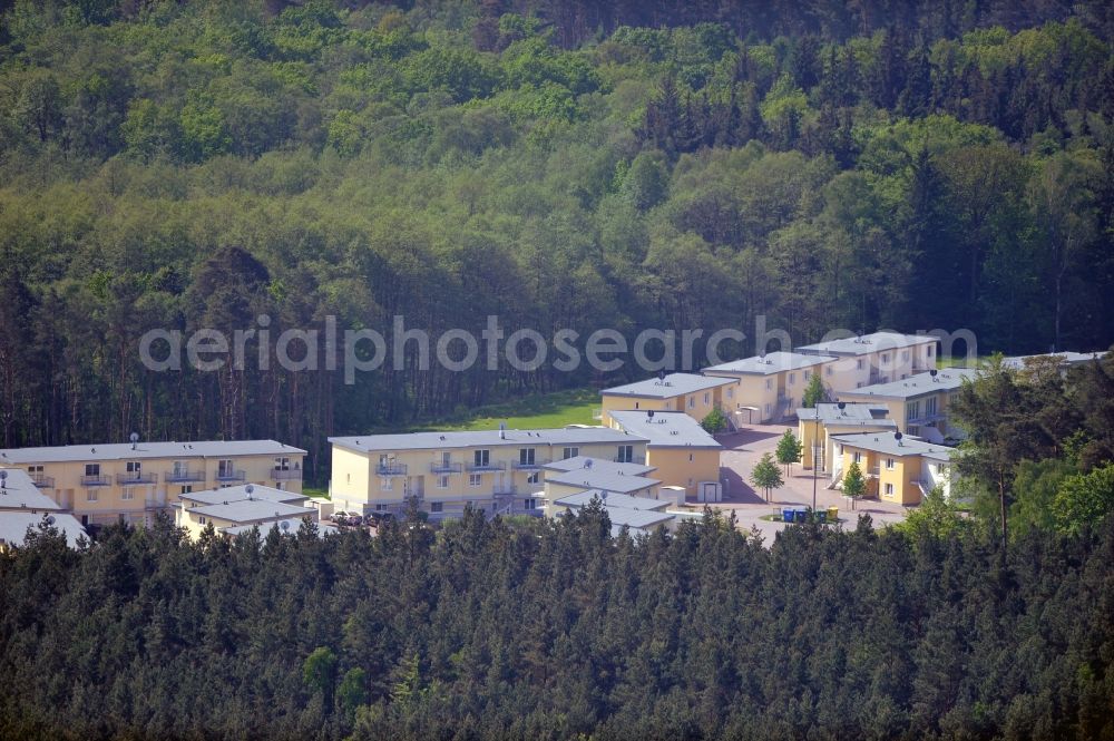 Aerial image Seeheilbad Graal-Müritz - Blick auf den Ferienwohnpark im Küstenwald der HAWO Bauträger KG in unmittelbarer Strandnähe im Ostseeheilbad Graal-Müritz. Aus einer ehemaligen NVA Liegenschaft entstanden bisher in zwei Bauabschnitten attraktive Ferienhäuser und Ferienwohneinheiten zum Verkauf und zur Vermietung. View of the coastal forest of the housing estate developers HAWO KG near the beach in the spa town of Graal Müritz.