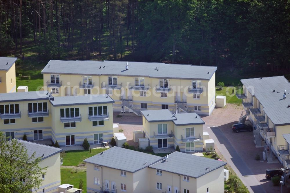 Aerial photograph Seeheilbad Graal-Müritz - Blick auf den Ferienwohnpark im Küstenwald der HAWO Bauträger KG in unmittelbarer Strandnähe im Ostseeheilbad Graal-Müritz. Aus einer ehemaligen NVA Liegenschaft entstanden bisher in zwei Bauabschnitten attraktive Ferienhäuser und Ferienwohneinheiten zum Verkauf und zur Vermietung. View of the coastal forest of the housing estate developers HAWO KG near the beach in the spa town of Graal Müritz.