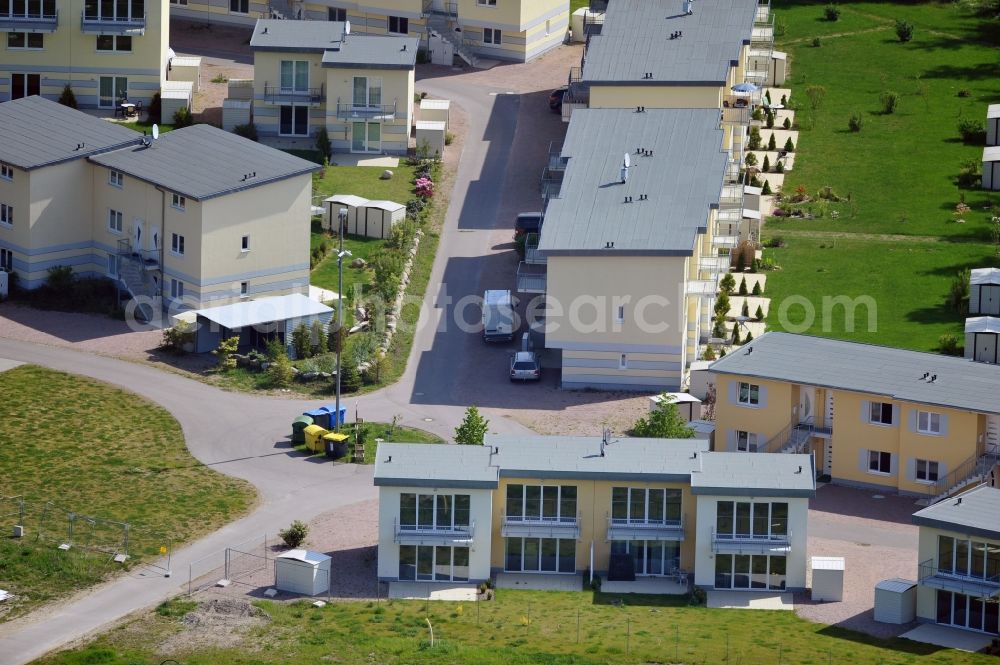 Seeheilbad Graal-Müritz from the bird's eye view: Blick auf den Ferienwohnpark im Küstenwald der HAWO Bauträger KG in unmittelbarer Strandnähe im Ostseeheilbad Graal-Müritz. Aus einer ehemaligen NVA Liegenschaft entstanden bisher in zwei Bauabschnitten attraktive Ferienhäuser und Ferienwohneinheiten zum Verkauf und zur Vermietung. View of the coastal forest of the housing estate developers HAWO KG near the beach in the spa town of Graal Müritz.