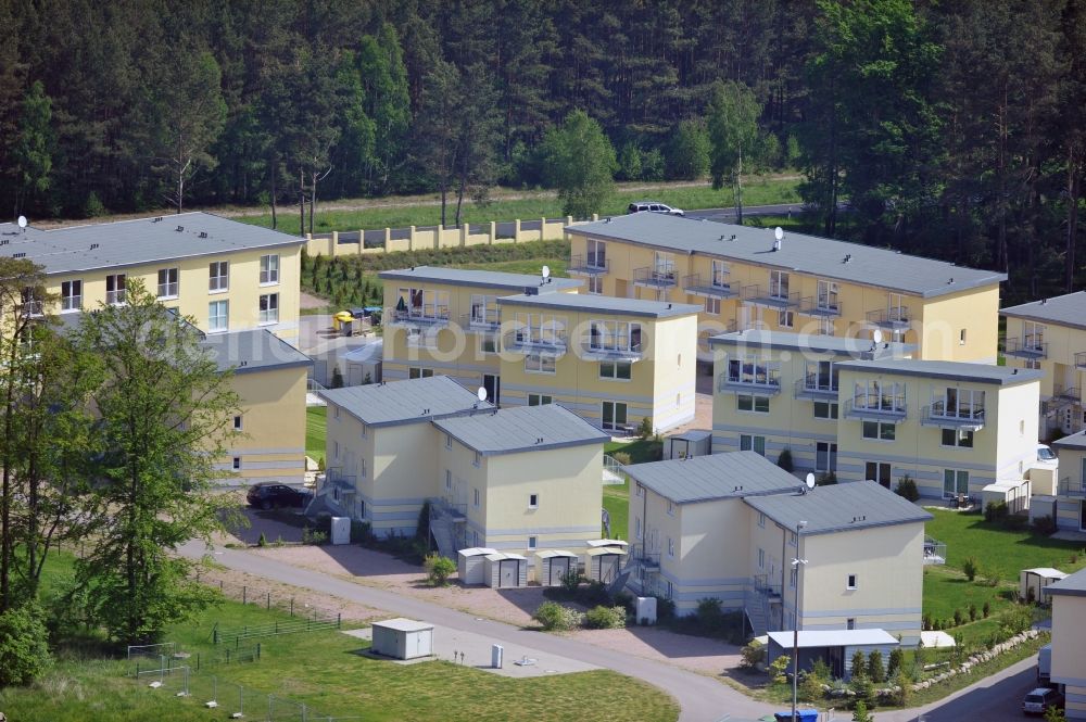 Aerial image Seeheilbad Graal-Müritz - Blick auf den Ferienwohnpark im Küstenwald der HAWO Bauträger KG in unmittelbarer Strandnähe im Ostseeheilbad Graal-Müritz. Aus einer ehemaligen NVA Liegenschaft entstanden bisher in zwei Bauabschnitten attraktive Ferienhäuser und Ferienwohneinheiten zum Verkauf und zur Vermietung. View of the coastal forest of the housing estate developers HAWO KG near the beach in the spa town of Graal Müritz.