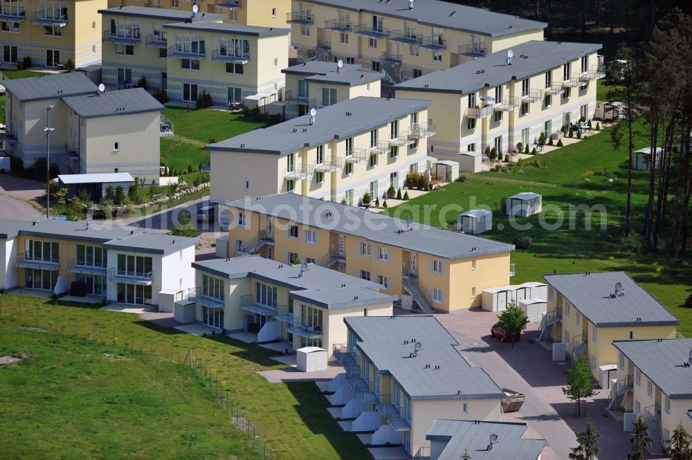 Aerial photograph Seeheilbad Graal-Müritz - Blick auf den Ferienwohnpark im Küstenwald der HAWO Bauträger KG in unmittelbarer Strandnähe im Ostseeheilbad Graal-Müritz. Aus einer ehemaligen NVA Liegenschaft entstanden bisher in zwei Bauabschnitten attraktive Ferienhäuser und Ferienwohneinheiten zum Verkauf und zur Vermietung. View of the coastal forest of the housing estate developers HAWO KG near the beach in the spa town of Graal Müritz.