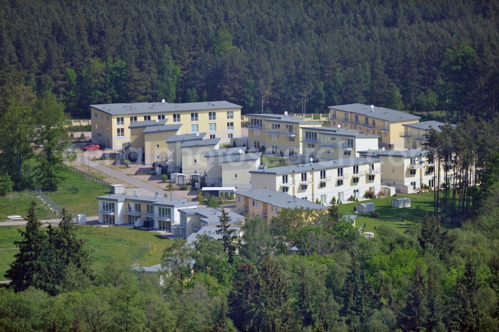 Aerial image Seeheilbad Graal-Müritz - Blick auf den Ferienwohnpark im Küstenwald der HAWO Bauträger KG in unmittelbarer Strandnähe im Ostseeheilbad Graal-Müritz. Aus einer ehemaligen NVA Liegenschaft entstanden bisher in zwei Bauabschnitten attraktive Ferienhäuser und Ferienwohneinheiten zum Verkauf und zur Vermietung. View of the coastal forest of the housing estate developers HAWO KG near the beach in the spa town of Graal Müritz.