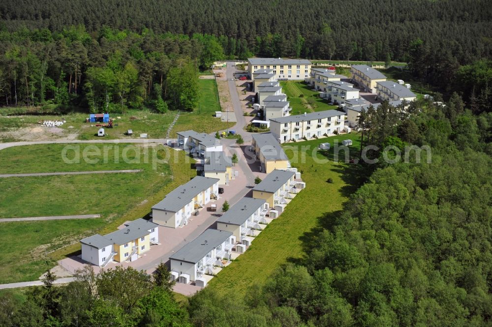 Aerial image Seeheilbad Graal-Müritz - Blick auf den Ferienwohnpark im Küstenwald der HAWO Bauträger KG in unmittelbarer Strandnähe im Ostseeheilbad Graal-Müritz. Aus einer ehemaligen NVA Liegenschaft entstanden bisher in zwei Bauabschnitten attraktive Ferienhäuser und Ferienwohneinheiten zum Verkauf und zur Vermietung. View of the coastal forest of the housing estate developers HAWO KG near the beach in the spa town of Graal Müritz.