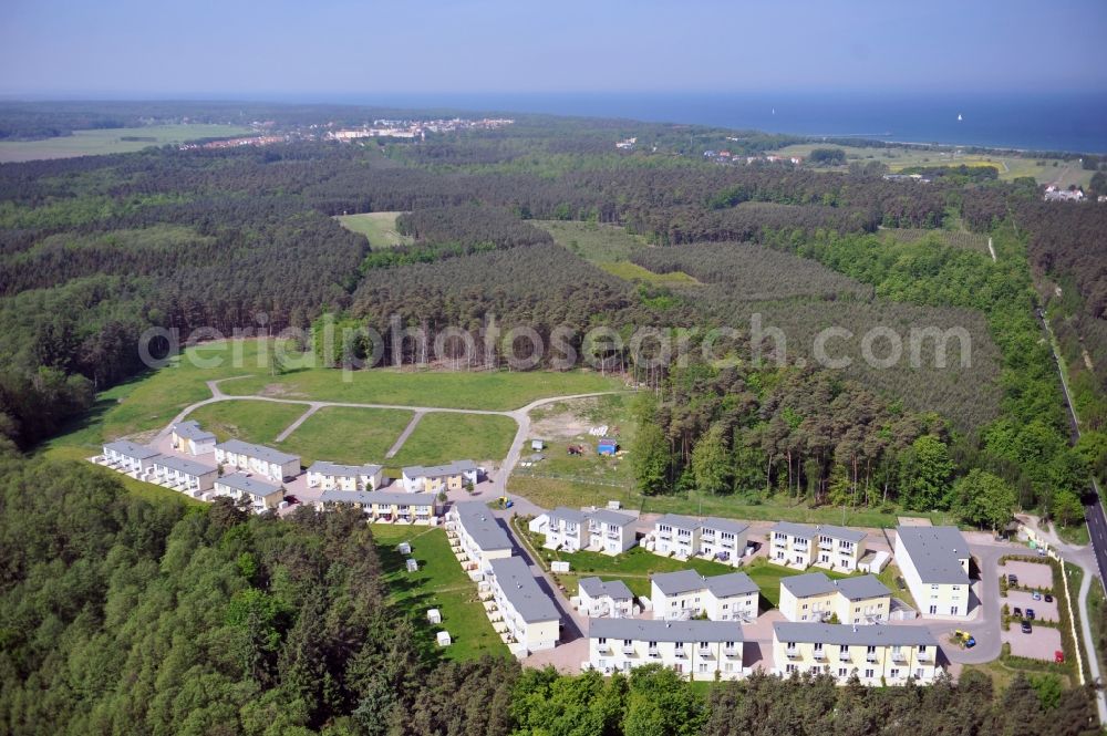 Aerial image Seeheilbad Graal-Müritz - Blick auf den Ferienwohnpark im Küstenwald der HAWO Bauträger KG in unmittelbarer Strandnähe im Ostseeheilbad Graal-Müritz. Aus einer ehemaligen NVA Liegenschaft entstanden bisher in zwei Bauabschnitten attraktive Ferienhäuser und Ferienwohneinheiten zum Verkauf und zur Vermietung. View of the coastal forest of the housing estate developers HAWO KG near the beach in the spa town of Graal Müritz.