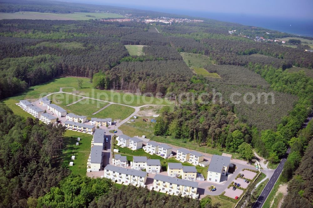 Aerial photograph Seeheilbad Graal-Müritz - Blick auf den Ferienwohnpark im Küstenwald der HAWO Bauträger KG in unmittelbarer Strandnähe im Ostseeheilbad Graal-Müritz. Aus einer ehemaligen NVA Liegenschaft entstanden bisher in zwei Bauabschnitten attraktive Ferienhäuser und Ferienwohneinheiten zum Verkauf und zur Vermietung. View of the coastal forest of the housing estate developers HAWO KG near the beach in the spa town of Graal Müritz.