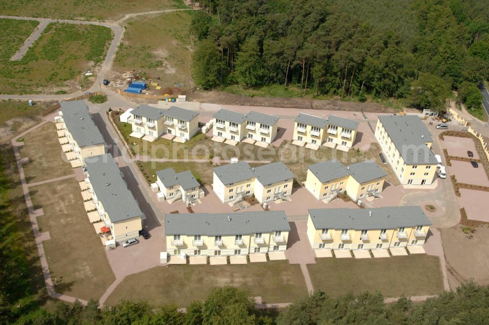 Aerial photograph Ostseebad Graal-Müritz - Blick auf den Ferienwohnpark im Küstenwald der HAWO Bauträger KG in unmittelbarer Strandnähe im Ostseeheilbad Graal-Müritz. Aus einer ehemaligen NVA Liegenschaft entstanden attraktive Ferienhäuser und Ferienwohneinheiten zum Verkauf und zur Vermietung