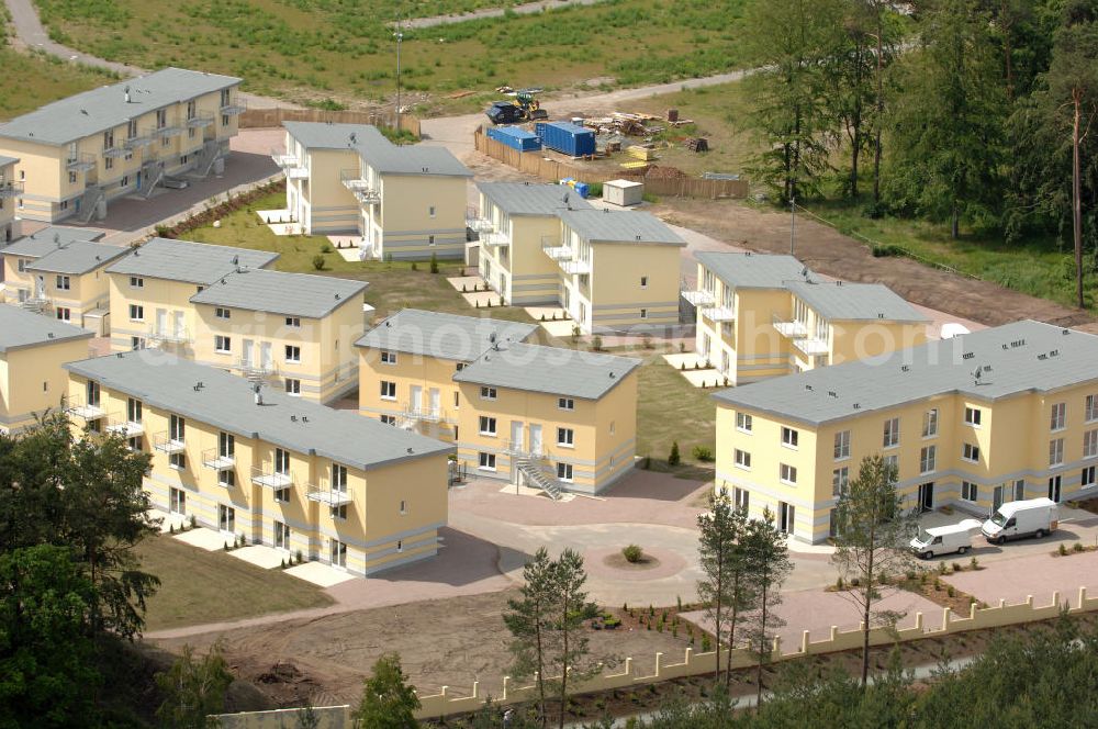 Ostseebad Graal-Müritz from the bird's eye view: Blick auf den Ferienwohnpark im Küstenwald der HAWO Bauträger KG in unmittelbarer Strandnähe im Ostseeheilbad Graal-Müritz. Aus einer ehemaligen NVA Liegenschaft entstanden attraktive Ferienhäuser und Ferienwohneinheiten zum Verkauf und zur Vermietung