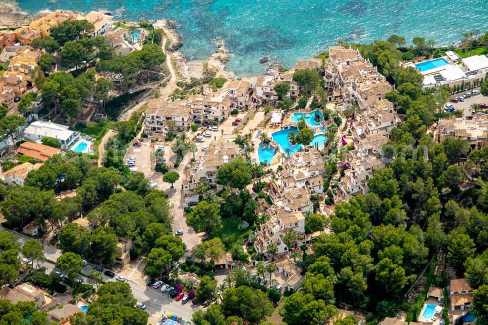 Aerial image Costa de la Calma - Building of an apartment building used as an apartment complex Club Monte de Oro on street Carrer Mirador in Costa de la Calma in Balearic island of Mallorca, Spain