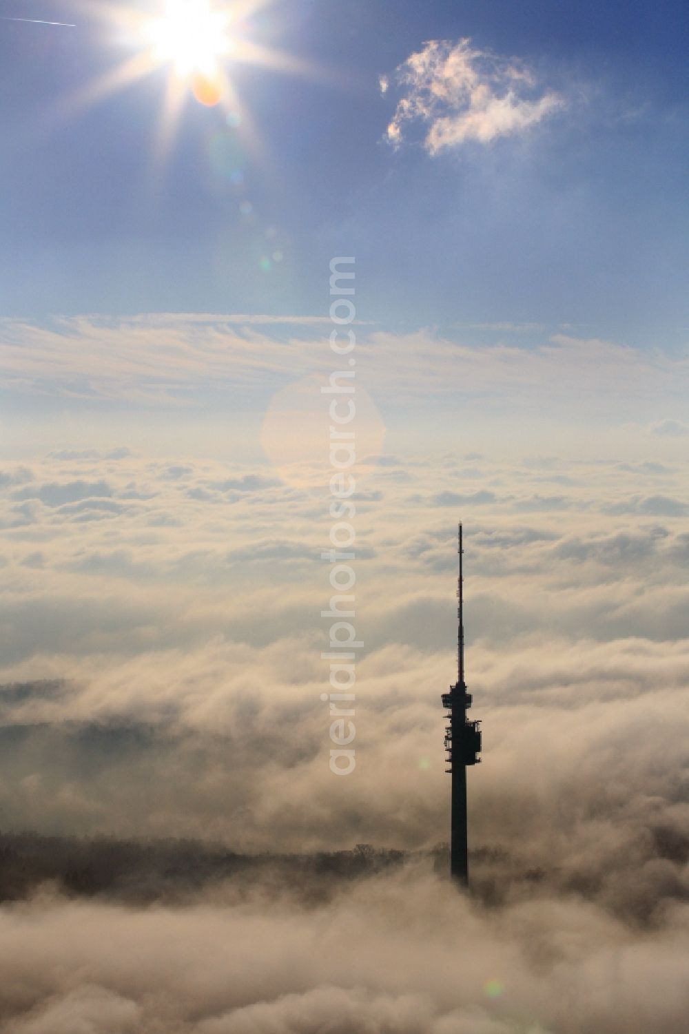 Bettingen from the bird's eye view: Television Tower St. Chrischona in Bettingen in Basel, Switzerland is standing out of the autumn fog. Blue sky and sunshine