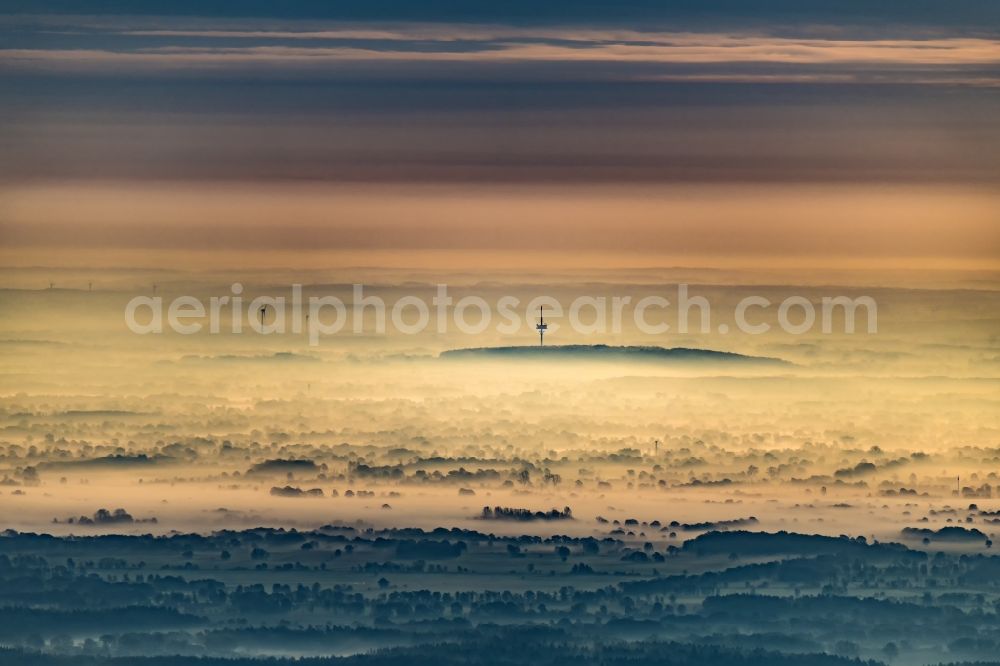 Grabau from the bird's eye view: Ground fog shrouded in sunrise in the telecommunications tower in Grabau Klingberg in the state Schleswig-Holstein, Germany