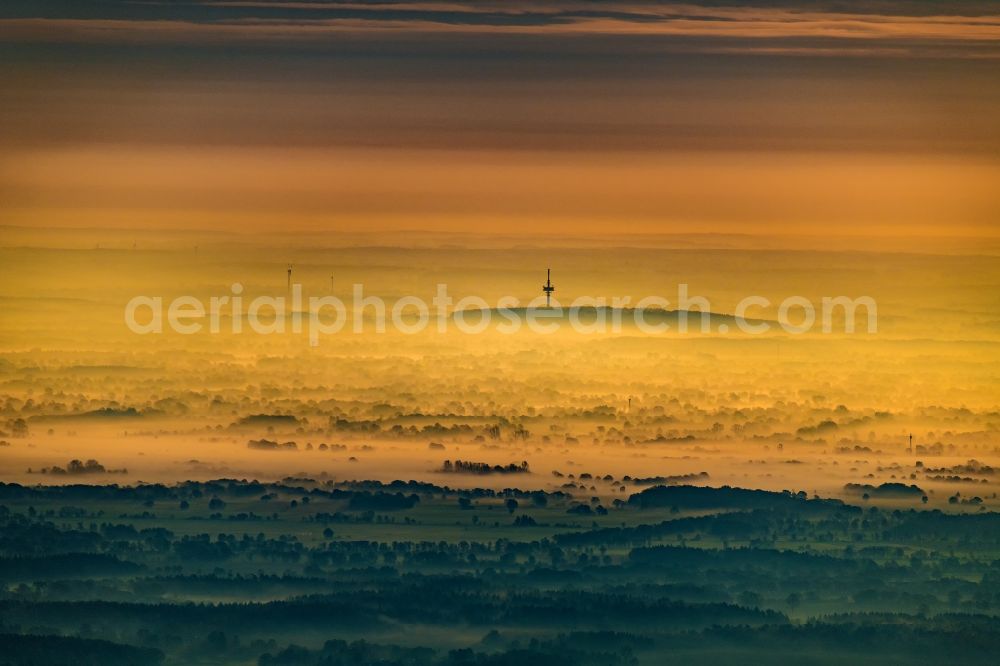 Aerial image Grabau - Ground fog shrouded in sunrise in the telecommunications tower in Grabau Klingberg in the state Schleswig-Holstein, Germany