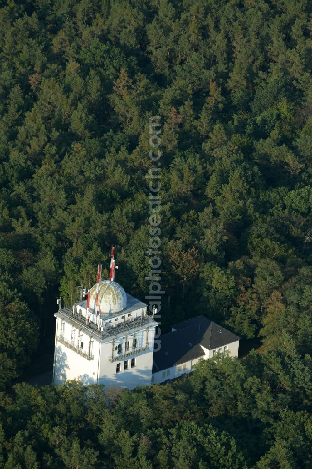 Aerial image Berlin - Television Tower Mueggelberge in the district of Treptwo-Koepenick in Berlin in Germany. The originally planned Television Tower of Berlin is located in a forest with a dome on the top