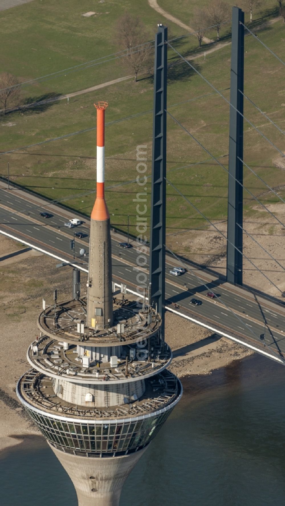 Düsseldorf from above - View of the telecommunications tower Rheinturm in Dusseldorf in the state North Rhine-Westhalia. The Rheinturm carries aerials for directional radio, FM and TV transmitters and DVB-T