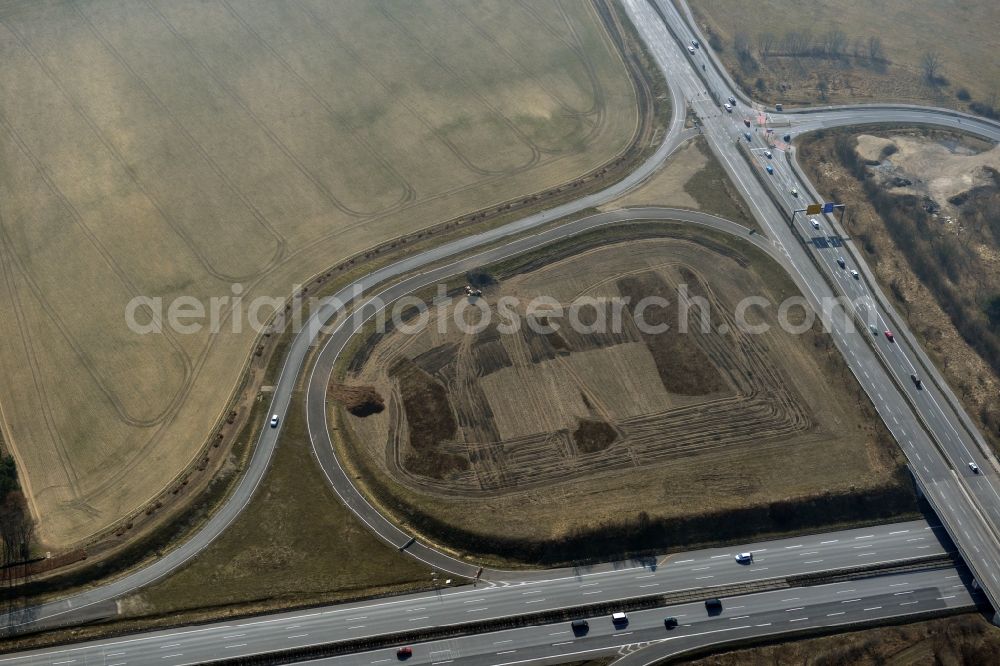 Rangsdorf from the bird's eye view: Finished construction of the expansion slope at the Berliner Ring motorway A10 - E30 at the exit to the main road B96 near Rangsdorf in Brandenburg