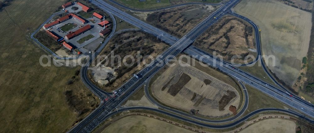 Rangsdorf from the bird's eye view: Finished construction of the expansion slope at the Berliner Ring motorway A10 - E30 at the exit to the main road B96 near Rangsdorf in Brandenburg