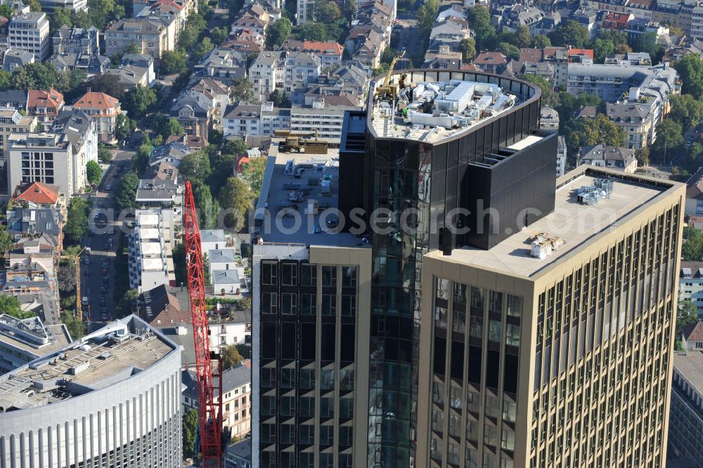 Aerial photograph Frankfurt am Main - Fertiger Neubau des Hochhauses Tower 185 , dem derzeit höchstem, in Deutschland im Bau befindlichen Wolkenkratzer. Bauherr ist dieCA IMMO Deutschland (formals Vivico Real Estate). Die Wirtschaftsprüfungsgesellschaft PricewaterhouseCoopers (PwC) hat bereits vor Baubeginn 60.000 Quadratmeter von insgesamt rund 90.000 Quadratmeter Bürofläche langfristig angemietet und wird hier ihre neue Deutschland-Zentrale beziehen. Den Entwurf für den Tower 185 lieferte der Frankfurter Architekt Christoph Mäckler. Er sieht ein hufeisenförmig angelegtes Sockelgebäude vor, aus dem sich die beiden Hochhaushälften mit einer Aluminium-Glas-Fassade erheben. View of the construction site of Tower 185, currently the highest skyscraper in Germany under construction. Owner is the CA IMMO (former Vivico real estate).