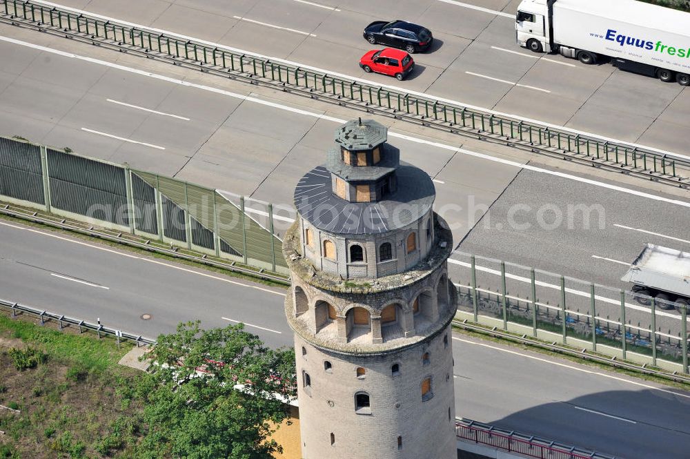 Aerial image Königs Wusterhausen OT Niederlehme - Blick auf das Wahrzeichen von Niederlehme, den Wasserturm an der BAB Autobahn A10 am Berliner Ring in Königs Wusterhausen. Der Turm wurde 1902 nach dem Vorbild des Istanbuler Galataturms, eines Christus-Turms aus den Jahren 1348/1349, fertiggestellt. View of the landmark Niederlehme, the water tower on the A10 motorway Berliner Ring.