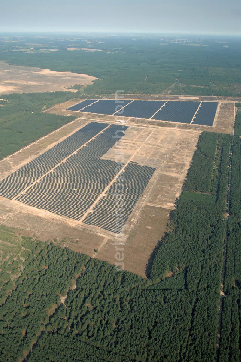 Aerial image Lieberose - Blick auf den ehemaligen Truppenübungsplatz Lieberose am Tag vor der offiziellen Inbetriebnahme der bisher zweitgrößte PV-Anlage der Welt durch die juwi Holding AG. Lieberose ist aber nicht nur in Leistung und Finanzierung beispielhaft, sondern auch ein Modellprojekt der Renaturierung militärischer Liegenschaften. Pressesprecher: Ralf Heidenreich; juwi Holding AG; Energie-Allee 1; D-55286 Wörrstadt; heidenreich@juwi.de