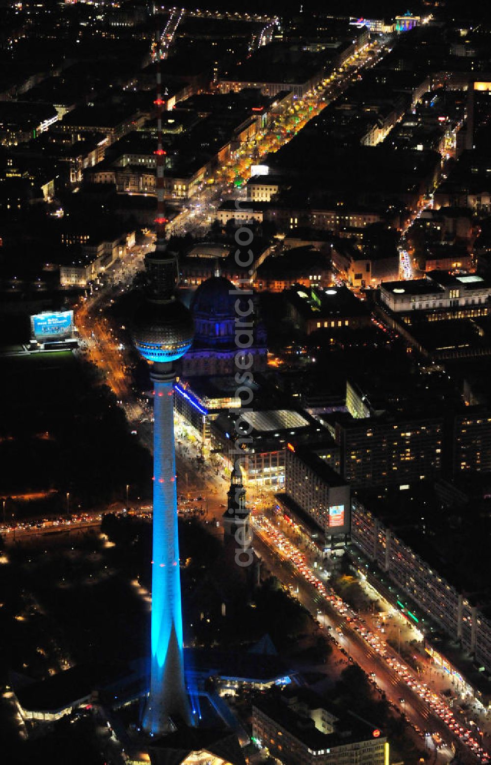 Berlin from above - Nachtaufnahme: Blick auf den Berliner Fernsehturm am Alexanderplatz und Sehenswürdigkeiten an der Karl-Liebknecht-Straße / Unter den Linden mit Beleuchtung anläßlich des Festival of Lights. Night Shot: View of the Berlin TV Tower at the Alexanderplatz and other sightsat the street Unter den Linden with illumination at the Festival of Lights.