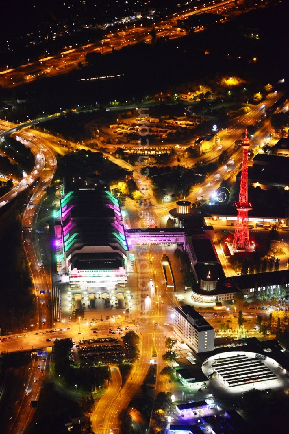 Aerial photograph Berlin - Festival of Lights downtown of the capital Berlin. Of October 10th to 21th numerous tourist and cultural attractions of the city are enveloped in a colorful light show. To be seen in the picture is the radio tower on the exhibition grounds in the district Charlottenburg