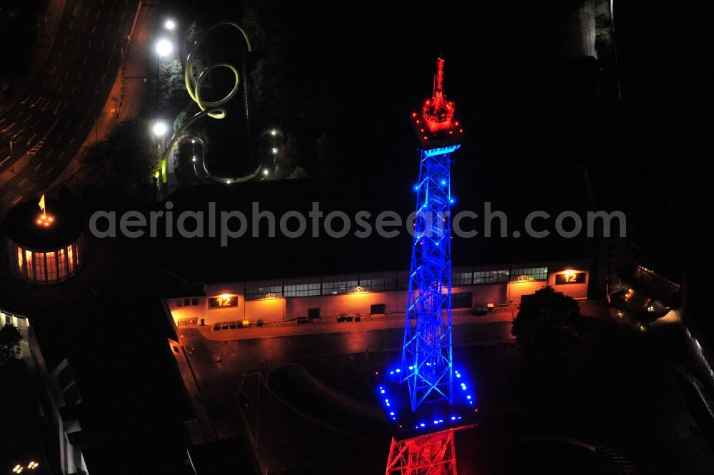 Berlin from the bird's eye view: Festival of Lights downtown of the capital Berlin. Of October 10th to 21th numerous tourist and cultural attractions of the city are enveloped in a colorful light show. To be seen in the picture is the radio tower on the exhibition grounds in the district Charlottenburg