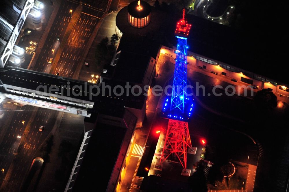 Berlin from above - Festival of Lights downtown of the capital Berlin. Of October 10th to 21th numerous tourist and cultural attractions of the city are enveloped in a colorful light show. To be seen in the picture is the radio tower on the exhibition grounds in the district Charlottenburg