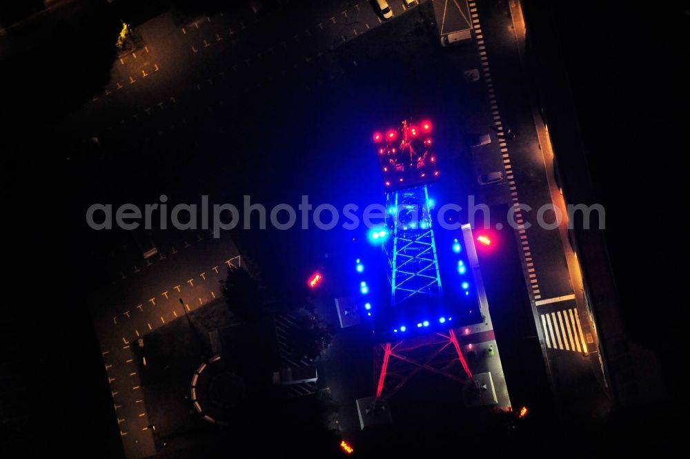 Aerial photograph Berlin - Festival of Lights downtown of the capital Berlin. Of October 10th to 21th numerous tourist and cultural attractions of the city are enveloped in a colorful light show. To be seen in the picture is the radio tower on the exhibition grounds in the district Charlottenburg