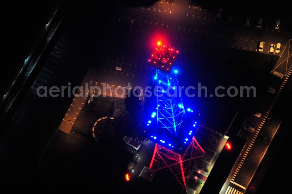 Berlin from above - Festival of Lights downtown of the capital Berlin. Of October 10th to 21th numerous tourist and cultural attractions of the city are enveloped in a colorful light show. To be seen in the picture is the radio tower on the exhibition grounds in the district Charlottenburg