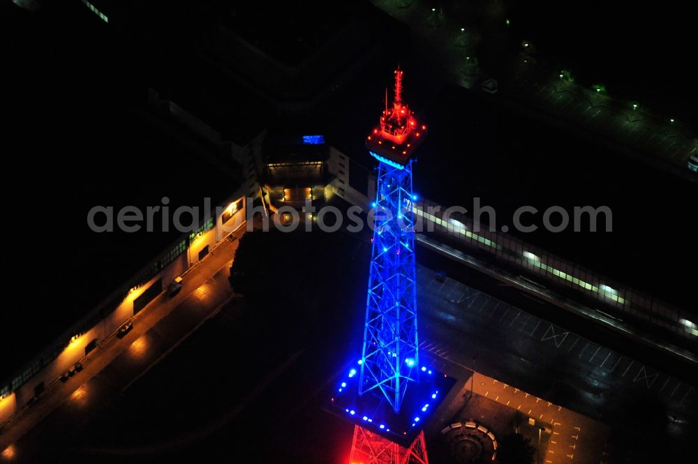 Berlin from the bird's eye view: Festival of Lights downtown of the capital Berlin. Of October 10th to 21th numerous tourist and cultural attractions of the city are enveloped in a colorful light show. To be seen in the picture is the radio tower on the exhibition grounds in the district Charlottenburg