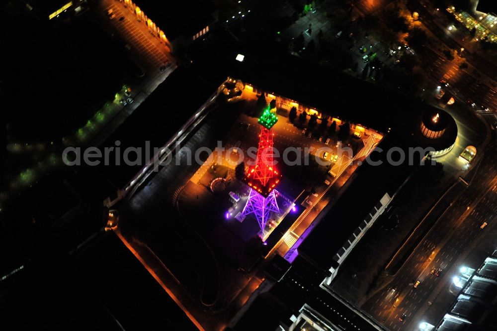 Aerial photograph Berlin - Festival of Lights downtown of the capital Berlin. Of October 10th to 21th numerous tourist and cultural attractions of the city are enveloped in a colorful light show. To be seen in the picture is the radio tower on the exhibition grounds in the district Charlottenburg