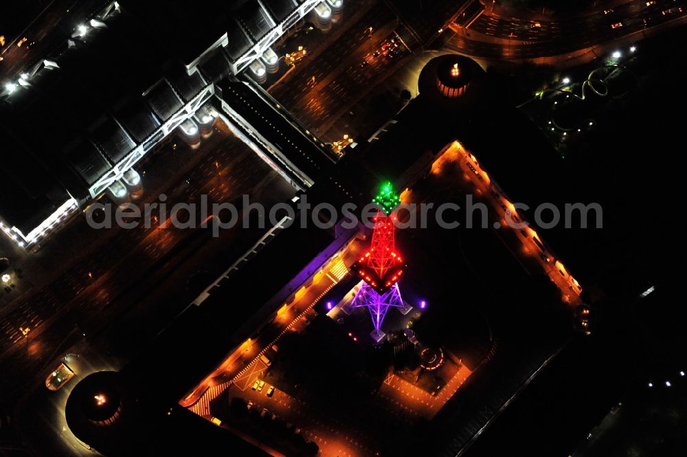 Berlin from above - Festival of Lights downtown of the capital Berlin. Of October 10th to 21th numerous tourist and cultural attractions of the city are enveloped in a colorful light show. To be seen in the picture is the radio tower on the exhibition grounds in the district Charlottenburg