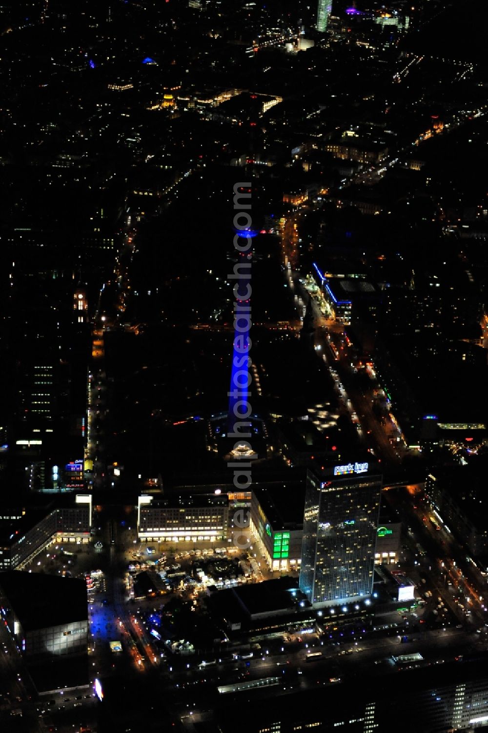 Berlin from above - Festival of Lights downtown of the capital Berlin. Of October 10th to 21th numerous tourist and cultural attractions of the city are enveloped in a colorful light show. To be seen in the picture is the TV tower and the Alexanderplatz