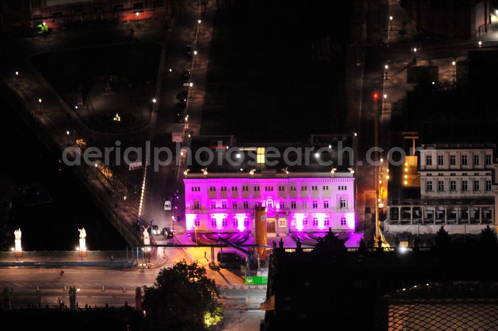 Berlin from above - Festival of Lights downtown of the capital Berlin. Of October 10th to 21th numerous tourist and cultural attractions of the city are enveloped in a colorful light show. To be seen in the picture the capital representation of the Bertelsmann SE & Co. KGaA Unter den Linden in the district Mitte