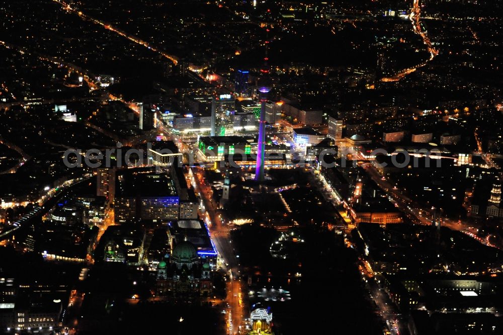 Berlin from above - Festival of Lights downtown of the capital Berlin. Of October 10th to 21th numerous tourist and cultural attractions of the city are enveloped in a colorful light show. To be seen in the picture is the TV tower and the Alexanderplatz