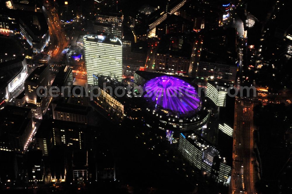 Berlin from above - Festival of Lights downtown of the capital Berlin. Of October 10th to 21th numerous tourist and cultural attractions of the city are enveloped in a colorful light show. To be seen in the picture is the Sony Center and the Potsdamer Platz